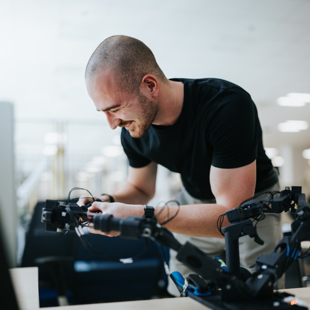 Lukas Navara working with robotic equipment